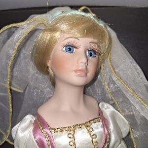 Beautiful Porcelain Doll 14 inches tall.